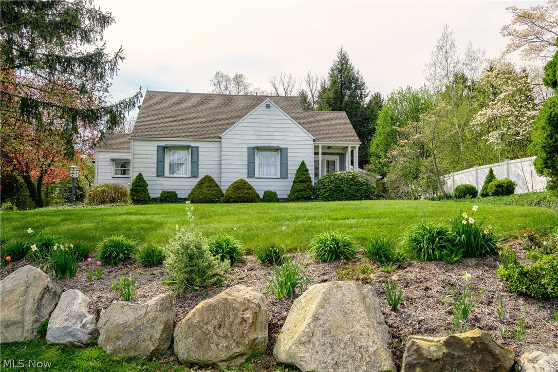 Amazing property with Adorable Bungalow ready for your personal touches. Three parcels equaling acres will convey including a serene pond, expansive grassy areas and Potting/Craft Shed with electricity. So many possibilities here with ample square footage and main level living.