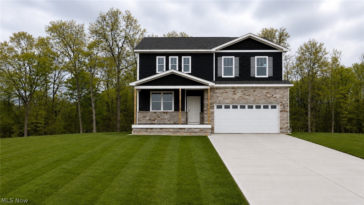Discover luxury living in Hawks Ridge with this beautifully designed Hampton quick move-in home situated on a private wooded homesite. Offering 2,670 sq. ft., this spacious two-story floor plan features 4 bedrooms, 2.5 baths, and a highly desirable extended garage.

Inside, you’ll find an open-concept layout designed for modern living, including an extended gathering room that creates the perfect space for entertaining and everyday comfort. The stunning fireplace serves as the focal point of the main living area, while the gourmet kitchen showcases elegant granite countertops, abundant cabinetry, and plenty of prep space for hosting family and friends.

The home also includes impressive 9-foot basement ceilings, offering endless possibilities for future finishing or additional storage space. Enjoy peaceful, wooded views and added privacy from your backyard, all while being conveniently located near Historic Downtown Medina, shopping, dining, and the highly rated Medina City School District.

This exceptional quick move-in opportunity combines thoughtful design, upscale finishes, and a premier homesite in one of Medina’s most exciting new communities.