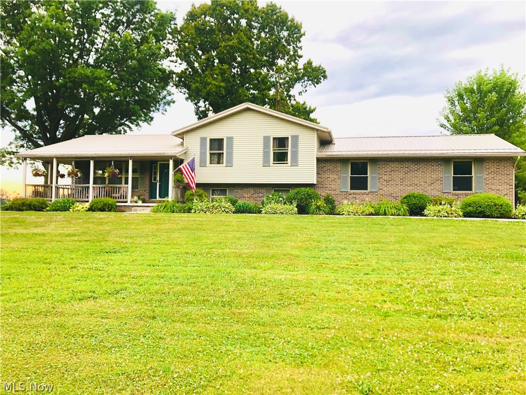 Looking for a home in the perfect country setting? You just found it! Even better than the location is the house itself! Built in 1997, this spacious split level is the perfect family home. Sizeable bedrooms are a definite plus. Your eat-in-kitchen has a slider off of the back and there are no words to describe the amazing views from it! Also off of the kitchen, a doorway to a wrap around porch and again, the views! A large family room right below, and a bonus room on the next lower level as well as storage. Park the car in your oversized attached 2 car garage and don't forget the other 3 car garage! There is a large parking pad outside the garage that is amazing for kids on bikes, cars, pets, whatever you need it for! Last but in no way least, new roof in 2020, new windows in 2022, new water softener system in 2022, and the Propane tank is full. WOW. This home is extremely well cared for...and the setting is perfection! Don't miss out on it!