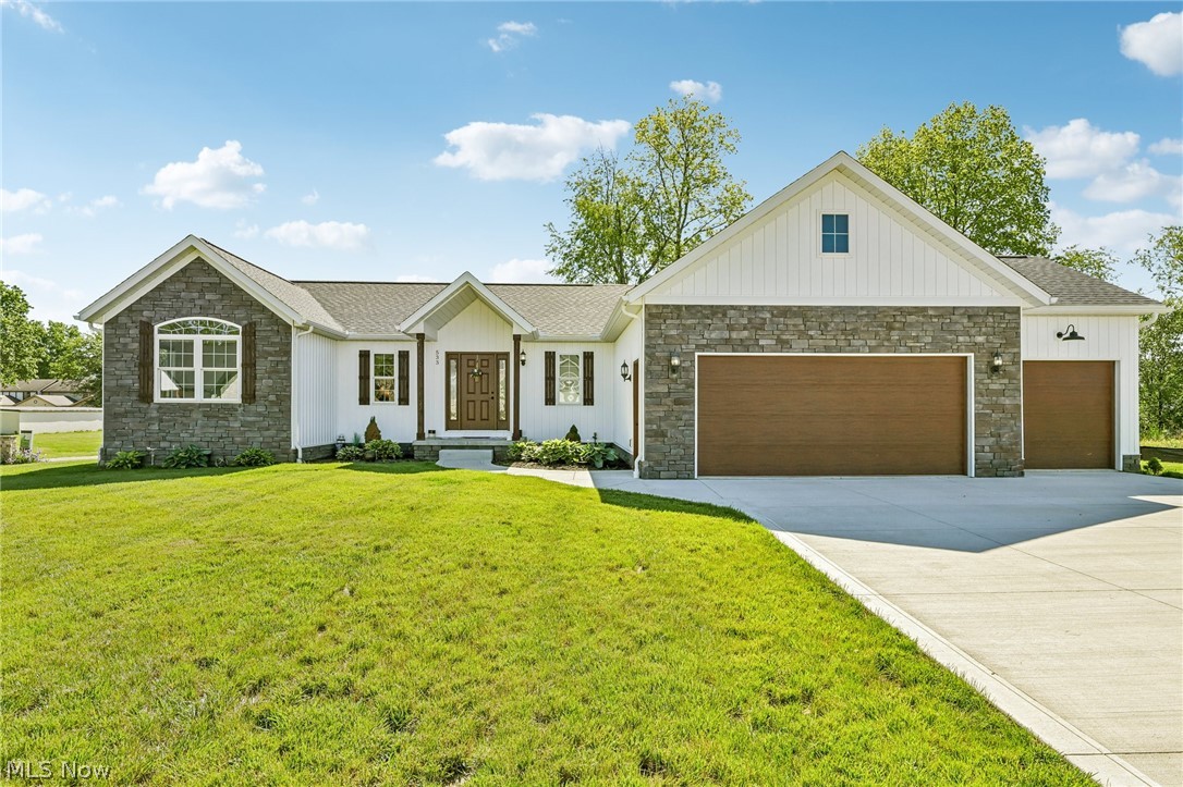 Beautiful custom ranch home in Lakewood Estates — built for comfort, function, and room to grow.
The open-concept layout centers around a vaulted living room that flows naturally into a well-appointed kitchen with quartz countertops, stainless appliances, and a center island with bar seating. The adjacent dining area opens directly to a covered back porch overlooking a generous backyard — ideal for entertaining or just unwinding after a long day.
Three bedrooms, two full baths. The primary suite is well thought out — walk-in closet, quartz double-sink vanity, and a tiled step-in shower. The second bath features a quartz vanity and tub/shower combo. First-floor laundry rounds out true single-level living.
Downstairs, full basement with 9 foot ceilings plumbed for a third full bath, it's a blank canvas for a future rec room, home office, or in-law suite. The three-car attached garage is equally practical — insulated doors, water, and floor drains already in place.
Tucked in a neighborhood of new construction with quick access to shopping, dining, and historic downtown Canal Fulton.