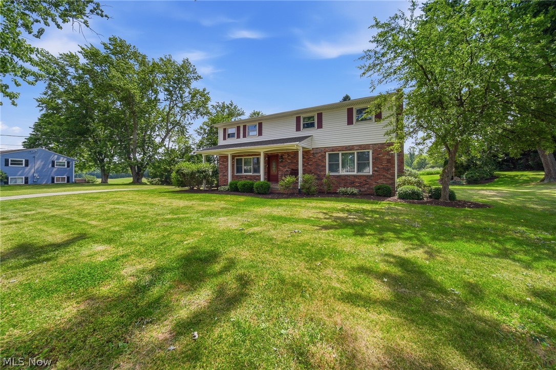 Meticulously maintained and cared for at every turn, this stunning 5-bedroom Colonial is nestled on a quiet road within the highly desirable Field Local School District. This one-of-a-kind home is being offered for sale by its original owners and builders for the very first time.  Charm, comfort, and warmth welcome you from the moment you arrive at the inviting front porch, complete with a swing—the perfect spot to enjoy your morning coffee. Step inside to a spacious foyer that opens to a large formal dining room, ideal for hosting family and friends. A pocket door separates the dining room from the kitchen, while large windows provide abundant natural light and showcase views of the private backyard. Beautiful custom wood flooring adds character and elegance throughout the space.
The thoughtfully designed kitchen is perfect for a growing family and any home chef, offering ample cabinet and countertop space for meal preparation and entertaining. The eat-in dining area features a large bay window overlooking the peaceful backyard.
The cozy family room includes a fireplace, creating a warm gathering space, while the adjoining sunroom offers additional living space filled with natural light. A conveniently located half bath sits between these areas. Step outside onto the deck, perfectly positioned off the sunroom, and enjoy the ideal setting to relax and unwind after a long day. Across from the dining room, you'll find an additional formal living room with large windows that further enhance the home's bright and welcoming atmosphere. Upstairs, all five bedrooms provide comfortable accommodations, including the spacious primary suite with its own private bath featuring a stand-up shower. An additional full bathroom serves the remaining bedrooms. The lower level, located just off the kitchen, offers plenty of storage space, houses the mechanical systems, and includes washer and dryer hookups. A rear-entry garage is conveniently accessible from this level.