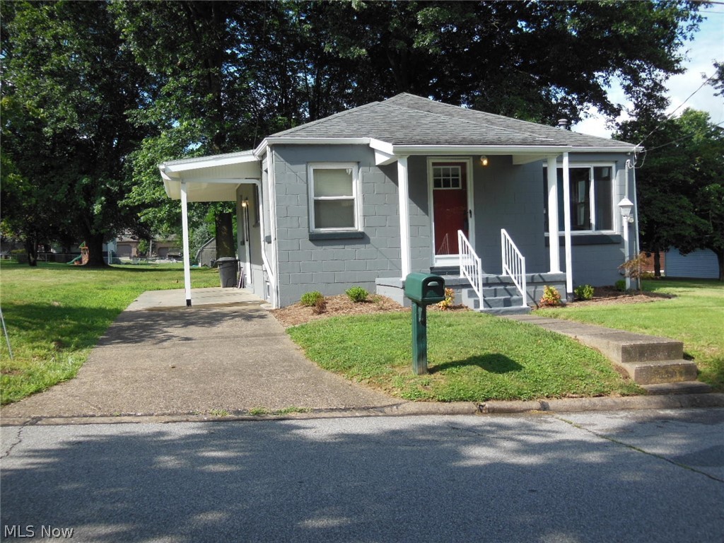Smaller home in a great location! Exterior freshly painted, new kitchen cabinets and countertop. Features concrete block construction, a ceiling fan in every room, new carpet in 2020, furnace, A/C, and garbage disposal all new in 2019, roof 2012. Home comes complete with appliances including a washer and dryer. The kitchen range is electric but can easily be changed to gas as there is already a gas connection in place. There is a full basement, covered patio, and some nice shade trees. Rear of property can be accessed by an unpaved alley. Get packed as this one is ready for immediate occupancy. Taxes not accurate at this time; will be re-assessed as this is part of what was a larger property. NEW ROOF 8/6/2021.