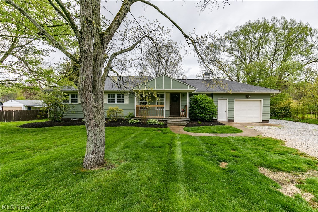 Welcome to this darling ranch located in Stow! Step on the front porch, where you could enjoy a cup of coffee and stare at your impressive front yard. The large living room is a great spot for entertaining, and has a sliding glass door to step outside on a nice sized deck. The deck will be the perfect place for all those summertime cookouts! The kitchen boasts beautiful cupboards that accent the backsplash, counter tops and stunning tile flooring. Three nicely sized bedrooms with a neutral paint color to make your own.  A nice area in the basement that could be turned into a rec room. Do not miss the large fenced back yard!