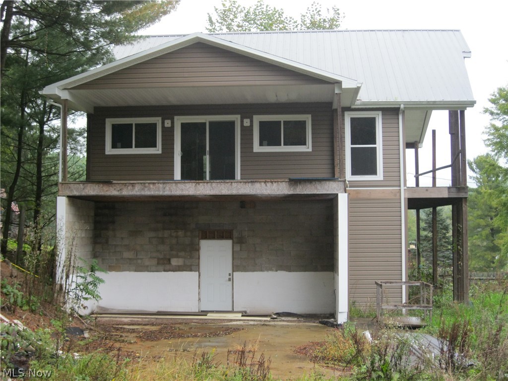 New home on Seneca Lake 75% completed. Finish this winter, move in spring. Exterior has been finished - metal roof, vinyl siding, windows, doors. This bi level home has 2000 ft. of living area. Utilities are at home, need tied in - septic (aerator) and drains are complete, elect. at pole is temp at house, water tap provided (needs tied into house). Most supplies are at house to complete interior - some drywall, kit. cabinets and countertop, insulation, brkr box, meter box, tankless hot water, furnace (propane) and more.  2nd floor has laminate flooring, naughty pine ceiling and walls.  Both baths have ceramic tile installed on floor and some of the walls.  2nd floor wiring is roughed in and all plmb has been roughed in. Boat dock comes with property (approx. $300/yr) - dock about quarter mile from home.