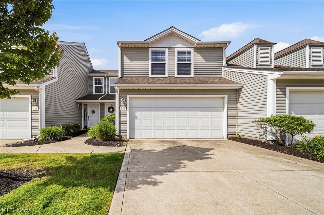 Welcome home to 988 Tradewinds Cove, a bright and welcoming townhouse condo located in the beautiful Lake Erie Shores development. This 3 bedroom/2.5 bathroom home features a spacious foyer leading into the open floor plan living room with vaulted ceilings. You'll find tasteful LVT flooring throughout the living/dining/kitchen, laundry with washer and dryer included and an attached two-car garage. A half bath is conveniently located on the main floor for guests. Off the dining room, a sliding glass door leads out to a modest patio. Upstairs, the master bedroom is a retreat with lots of natural light, vaulted ceilings and attached full bath. 2 additional bedrooms and a full bath complete the 2nd floor. You will also notice plenty of storage offered on both levels. Community amenities include a playground, basketball courts, paved walking paths, and Lake Erie access/privileges. A one-year home warranty is being offered for extra peace of mind. Come tour this well maintained home by the one and only owner and be next in line to enjoy all this home and family-friendly community has to offer.