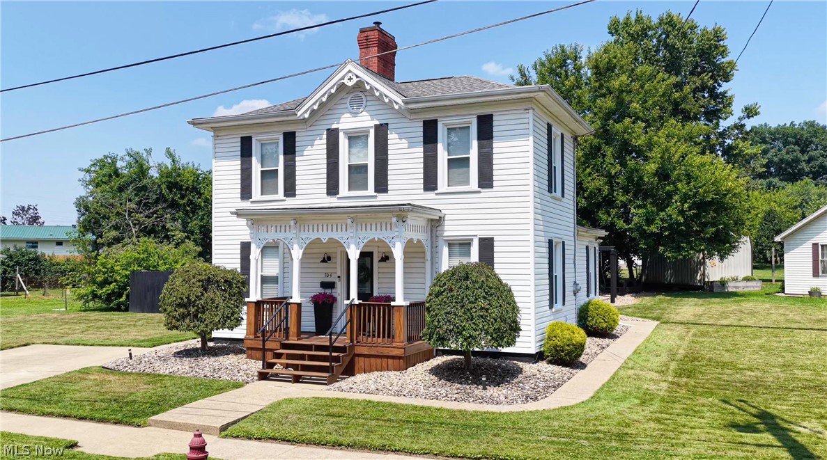Belpre's Hidden Gem, Historic Charm, Modern Comfort & Move-In Ready!
Tucked away in an established Belpre neighborhood, this beautifully restored two-story home is proof that some of the best homes are the ones you least expect. Blending timeless historic character with today's modern conveniences, this move-in ready home offers warmth, flexibility, and charm from the moment you arrive. The inviting front porch and intricate gingerbread trim create an unforgettable first impression and welcome you inside.
The main level features a warm and inviting living room, an updated kitchen with subway tile backsplash, stainless steel appliances, and a breakfast bar that's perfect for casual meals and everyday living. You'll also appreciate the convenience of a main-level bedroom and laundry, offering the flexibility and ease of one-floor living when desired.

Upstairs, you'll find two additional bedrooms plus an oversized sitting room or game room that provides the perfect second living area. Whether you need a home office, media room, hobby space, playroom, or guest retreat, this versatile space easily adapts to your lifestyle.

Throughout the home, thoughtful updates complement its historic charm while preserving the craftsmanship that makes homes like this so special. Tall ceilings, oversized windows, beautiful trim work, and abundant natural light create a warm, inviting atmosphere that's difficult to find in today's homes.

Step outside and enjoy beautifully maintained landscaping, a covered side porch, and a spacious yard with plenty of room to relax, entertain, or garden. Every detail reflects the care and pride that's been poured into this home over the years.

If you've been searching for a home that's truly move-in ready without sacrificing character, this hidden gem offers a rare opportunity to enjoy the best of both old and new. Come experience it in person, you may just discover that your favorite part of this home is something the photos can't capture.