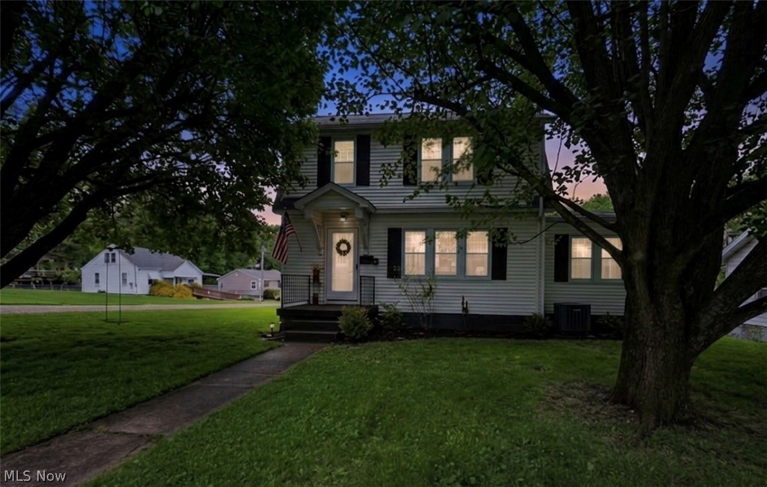 Perfect timing for this adorable 4 bedroom, 2.5 bath home with wonderful curb appeal and its on a large treed, landscaped corner lot. You will love the neutral colors throughout with wood floors and spacious rooms! The covered front porch will greet your guests as they walk into the amazing well lit living room with a cozy brick fireplace that is flanked by open display shelving.  The dining room with chandelier opens into both living and kitchen spaces for easy entertaining.  The kitchen which was remodeled in 2020 has lots of counter space and cabinetry with all appliances included and it walks out to the covered rear porch for morning coffee and a good book. First floor primary bedroom/family room with 1/2 bath (bath updated in 2025) complete your first floor.  Walk up the wood railed staircase to 3 nice size bedrooms and a spacious full bath which was remodeled in 2021. The lower level is open with lots of storage options and is ready for your finishing touches.  Laundry area includes the washer and dryer and you have a finished full bath with shower. The rear of the home has a large drive way for extra parking needs, a fun play, entertaining area with a bar and stools. 2 car garage. Home Warranty Come see this beautiful home soon!
