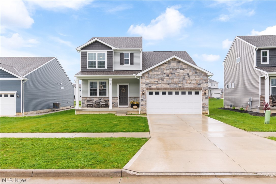 Welcome to 64 Brewster Dr in Tallmadge Reserve, a stunning 2024 Pulte built colonial offering 3 finished levels of modern living. This beautifully designed home features 3 bedrooms, 3.5 bathrooms, 2,250 Sq Ft above grade, plus 781 Sq Ft of finished basement space.

Step inside to a bright, open layout with luxury vinyl plank flooring, clean modern finishes, and a versatile front flex room currently used as an office. The heart of the home is the impressive kitchen, showcasing quartz countertops, white subway tile backsplash, white shaker cabinets with black hardware, stainless steel appliances, recessed lighting, a large pantry, and a center island with breakfast bar and pendant lighting. The kitchen flows seamlessly into the dining area and spacious living room, creating the perfect setting for everyday living & entertaining.

Upstairs, the owner’s suite offers a private retreat with a large walk-in closet and spa-like ensuite bath featuring dual sinks, white cabinetry, black accents, and a walk-in shower with bench seating and transom window. Two additional bedrooms, a full bath, and second-floor laundry add comfort & convenience.

The fully finished basement is a true standout, featuring LVP flooring, recessed lighting, a full bathroom, a flex room with closet, and a massive 26’ x 17’ recreation room, ideal for movie nights, guests, hobbies, fitness, or additional entertaining space.

Built in 2024, everything feels fresh, clean, and move-in ready. Additional upgrades include blinds throughout the main and upper levels, remote-controlled ceiling fans in the main living area and bedrooms, and a stone-accented exterior for added curb appeal.

Located in the desirable Tallmadge Reserve community with walking paths, a playground, and pond, this home offers the perfect blend of neighborhood charm, modern comfort, and everyday convenience near shopping, dining, Akron, and the heart of Tallmadge.
