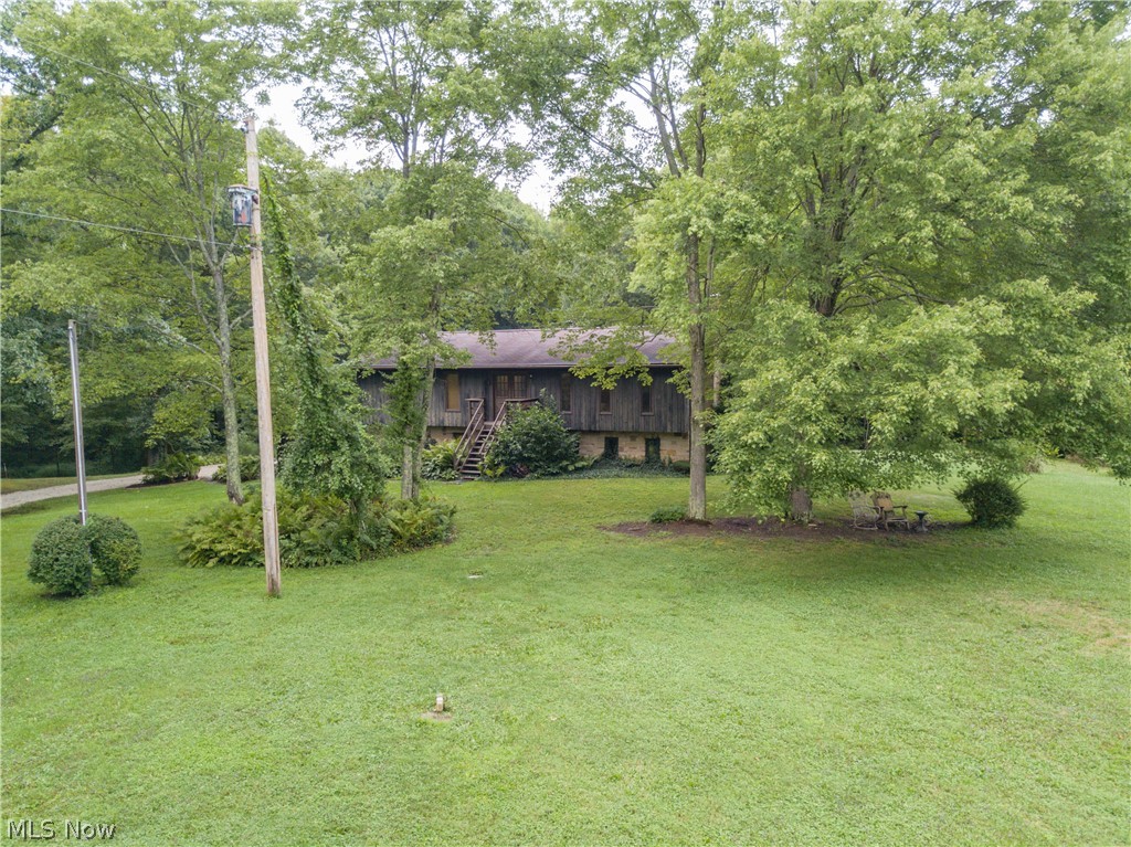 Welcome to views for days on this peaceful and serene setting on 20.475 acres. This raised ranch sits approximately 1/4 mile off of the road (about middle of the property) with a view of woods and a small pond in the back and a cleared view of a beautiful larger on-property pond in the front. To finish off this true vacation setting there is also a view of the neighbor's pond while sitting on your private 2nd level deck. This property boasts approx 10 acres of woods, a 1-acre pond in the front, and beautiful views everywhere. The seller has made updates inside to the bathrooms, floors, and fresh paint throughout. The lower level includes a stone wood-burning fireplace with heat-a-lator. This unique property needs to be seen to be appreciated, don't miss this opportunity.