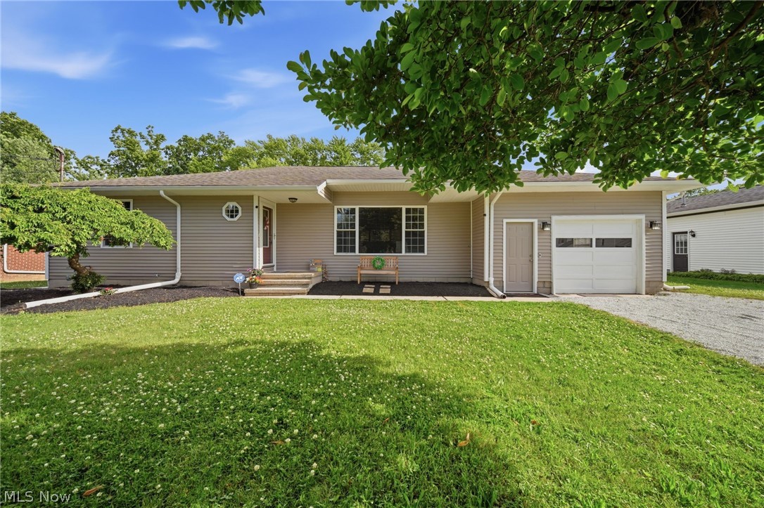 Stunning ranch style home in quiet Ashtabula Twp. This spotless, totally updated 3BD/2BA fresh design features open concept floor plan and beautifully landscaped sloping yard shaded by gorgeous magnolia, flowering cherry, pear & crab apple trees. The living room showcases a classic granite fireplace surrounded by built-in shelving units/cabinets, wall mount TV.  Large dining room, efficient galley kitchen boasts solid cherry cabinetry w/pullouts, pantry, gas range with double oven, French door frig, dishwasher, under cab lighting, bump out sink base and breakfast nook w/patio door view of back yard. Master bedroom with nicely finished ensuite, soaking tub, pedestal sink, dual cabinets. Plus, 2 addition bedrooms and a main bath offering soaking tub, unique copper vessel sink, artistic bronze towel and paper holders. Appealing Sculpted Brazilian Cherry flooring & matching wood blinds, ceramic tile, abundant windows through out. Full basement (waterproofed w/warranty), attached oversized single car garage, rear patio, beautiful neighborhood. Highly desirable single level living with room to add on or create a deck design for ultimate indoor/outdoor living!