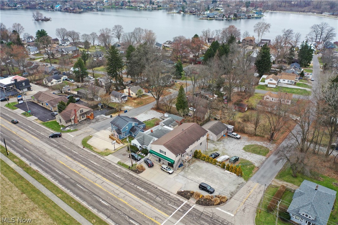 Exciting Auction Opportunity, Multi-Tenant Property, Warehouse/Shop with Apartments, Single Family Home Portage Lakes Area, Coventry Twp., Coventry Schools, Summit County, Sold Multi-Par (Buy One or Both) $36,672 Potential Gross Income, Zoned B-2 Limited Local Business. Live Onsite with Online Bidding Available on Real Estate. ABSOLUTE AUCTION, all sells to the highest bidders. ONLINE BIDDING BEGINS THURSDAY, APRIL 16, 2026, at 9:00 AM, and AUCTION LIVE ON-SITE BIDDING WILL BEGIN FRIDAY, APRIL 17, 2026, at 12:00 PM.  Auction #1: 3200 & 3202 S. Main St. Extremely clean, well-maintained commercial building. 5,320 sq. ft. two-story multi-tenant building. The main level has a reception area, two offices, workshop areas, a large storage room, a half bath, one overhead garage door, and separate entrances. Lower garage at the rear of the building with two overhead doors. Two residential units on the second level, each featuring two bedrooms, a large kitchen and dining room with an open concept, laundry room, full bath, and a wood deck. Summit County parcel #s 1907585 and 1907584. Drilled water well, city sewer. Built in 1950. 0.25-acre corner lot. Two-year NNN lease (as of 9/1/2024) with $29,556 annual income. Two electric meters and one gas meter. Cement pad and gravel parking lot. Two gas F/A furnaces with C/A and a gas heater in the garage. Wired for security and cameras.
Note: Parcels will be offered separately and together and sold whichever way they bring the most. The property will be open for inspection on auction day, starting at 10:00 AM. Auction #2: 3204 S. Main St. – see MLS #5198467.