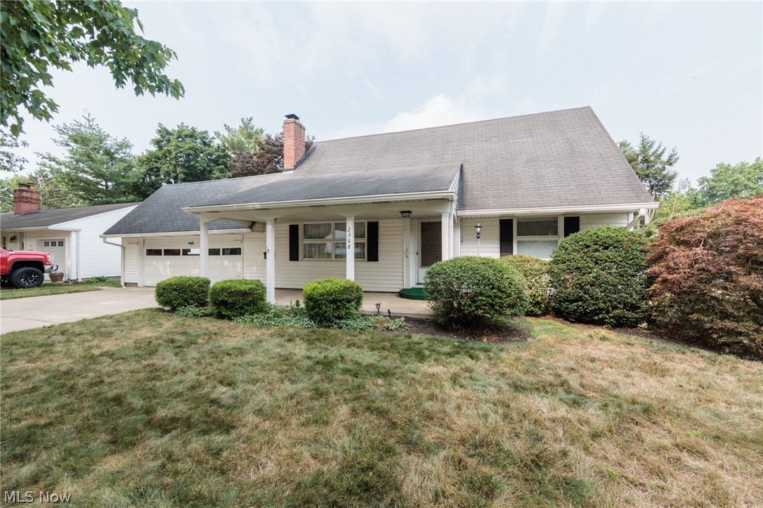 Welcome to this well-maintained, oversized Cape Cod-style home offering 4 bedrooms, 2.5 bathrooms, and the convenience of first-floor or lower-level laundry. Lovingly cared for by the same family for decades, this home is full of warmth and pride of ownership. Relax on the inviting covered front porch, perfect for enjoying your morning or evening sunsets. The rear patio provides an additional outdoor living space, ideal for entertaining or relaxing. Inside, the spacious living room features updated windows, a cozy fireplace, and hardwood floors beneath the carpet, offering the opportunity to restore their original beauty. The first-floor full bathroom has been updated with a walk-in shower, while the second-floor full bath includes a tub/shower combination. An additional shower is located in the lower level, providing extra convenience. Finished living space in lower-level featuring family room, craft or game room with plenty of storage. The oversize two car garage offers plenty of space for all you need. Storage above garage is a fabulous feature.  Major updates include a new furnace: highly efficient (2022), central air conditioning (2022), and a hot water tank (2025), giving added peace of mind. This is a wonderful opportunity to own a spacious, well-cared-for home with timeless charm and modern mechanical updates.