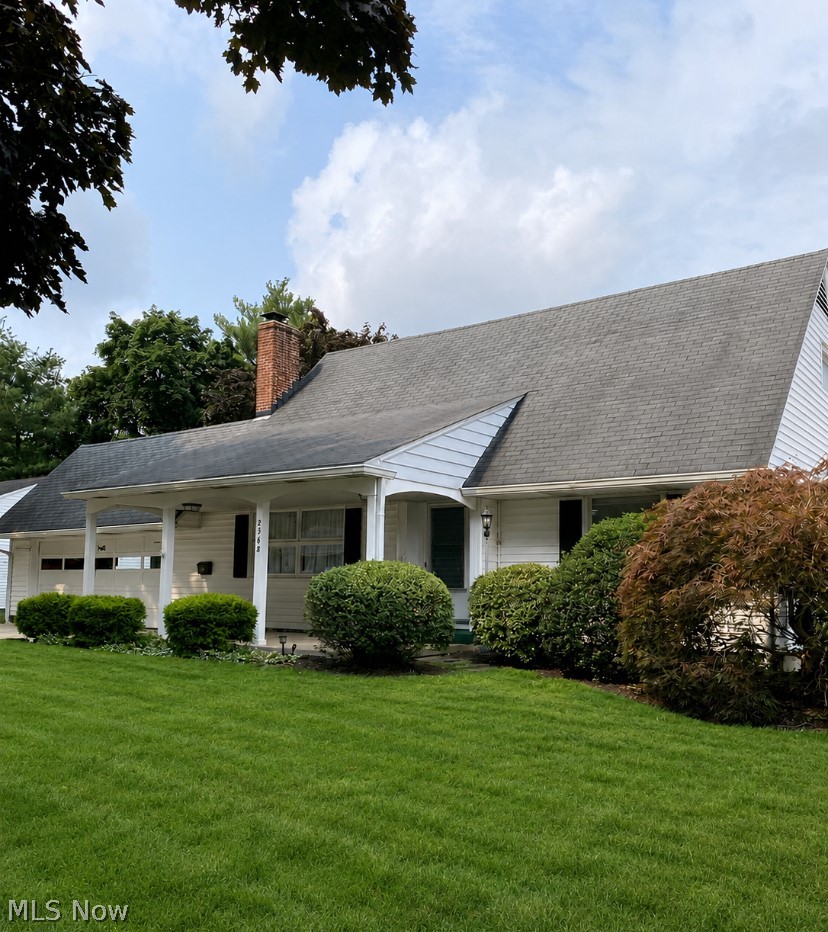 Welcome to this well-maintained, oversized Cape Cod-style home offering 4 bedrooms, 2.5 bathrooms, and the convenience of first-floor or lower-level laundry. Lovingly cared for by the same family for decades, this home is full of warmth and pride of ownership. Relax on the inviting covered front porch, perfect for enjoying your morning or evening sunsets. The rear patio provides an additional outdoor living space, ideal for entertaining or relaxing. Inside, the spacious living room features updated windows, a cozy fireplace, and hardwood floors beneath the carpet, offering the opportunity to restore their original beauty. The first-floor full bathroom has been updated with a walk-in shower, while the second-floor full bath includes a tub/shower combination. An additional shower is located in the lower level, providing extra convenience. Finished living space in lower-level featuring family room, craft or game room with plenty of storage. The oversize two car garage offers plenty of space for all you need. Storage above garage is a fabulous feature.  Major updates include a new furnace: highly efficient (2022), central air conditioning (2022), and a hot water tank (2025), giving added peace of mind. This is a wonderful opportunity to own a spacious, well-cared-for home with timeless charm and modern mechanical updates.