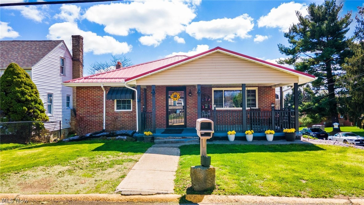 NEW LIST PRICE! Tucked on a corner lot, this inviting ranch-style home brings together comfort, character, and a touch of the outdoors. With four bedrooms all on the main level, it offers easy, one-floor living wrapped in a warm, cabin-like atmosphere. Step inside to find rich elm-lined walls that give much of the home a natural, woodsy charm. The open kitchen and dining area feature seamless concrete countertops and a layout that feels both functional and welcoming—perfect for gathering over a home-cooked meal. The space flows easily into the great room, creating a relaxed setting for everyday living or quiet evenings in.  French doors open onto a spacious covered deck, where you can unwind and take in views of the large, fenced backyard—ideal for pets, play, or simply enjoying the fresh air.  The main level includes a comfortable primary bedroom and an updated full bath with ceramic flooring. A two-car garage, durable metal roof, and the added privacy of a corner lot round out the property. If you’re looking for a place with a little rustic soul and plenty of practical space, this home is ready to welcome you in.  Less than about 5 minutes from PA state line, RT 22, and elementary school.   SELLER WILL NOT LOOK AT ANY SALE CONTINGENCY AT THE TIME OF LISTING, PRE APPROVED BUYERS TO MAKE APPTS PER SELLER KIND REQUESTS, SELLER WILL ONLY LOOK AT OFFERS WITH A MINIMUM OF 1% EARNEST MONEY.  AMENITY LIST PROVIDED WITH MORE UPDATES AND PERSONAL PROPERTY DISTRIBUTION.