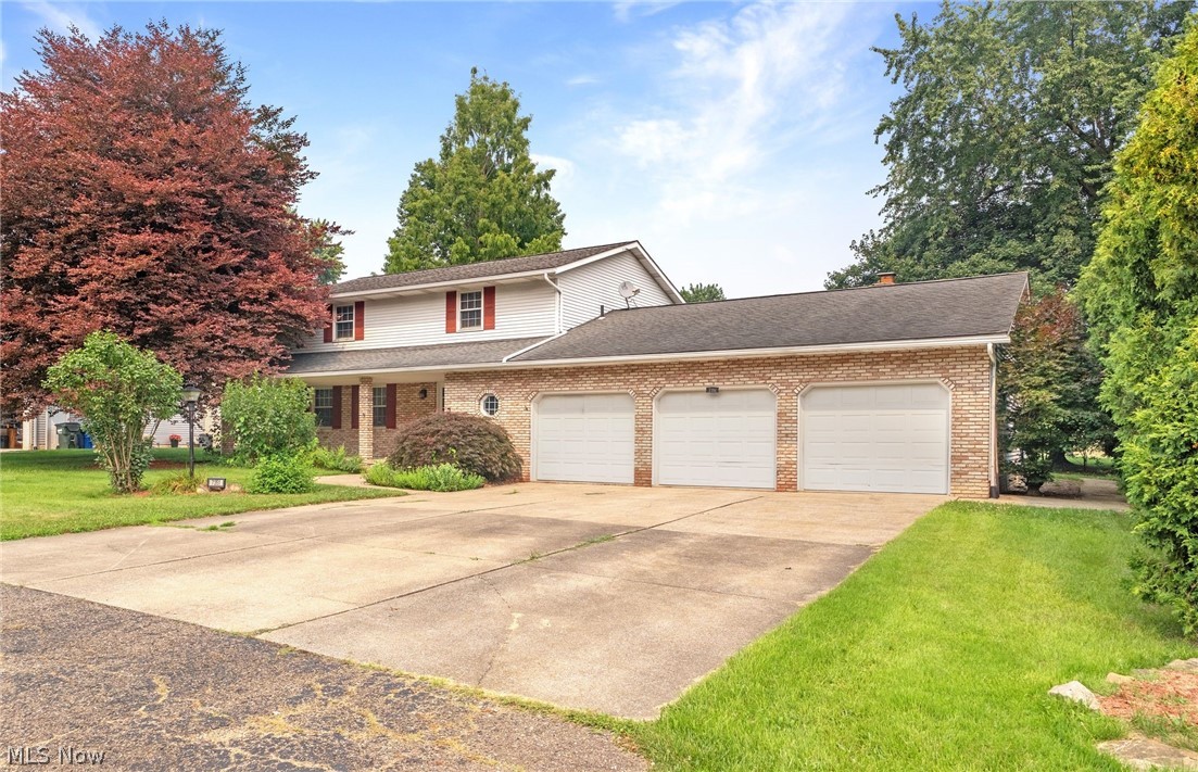 Welcome to 7351 Ashburton Circle NW....located in Foxmoor Estates, this 4 bedroom 2.5 bath home is ready for a new owner! Beautifully updated with LVT flooring through out the first floor(2025) and new carpet (2026) on the second floor. The spacious  kitchen features a floating island, granite counters, a pantry, and can lighting. The breakfast area is open to the family room and leads to the attached greenhouse and backyard. The first floor living space includes a living room, family room, formal dining room and office/guest bedroom. Upstairs you will find three large bedrooms that share the remodeled bathroom (2025). The master bedroom has an updated private bath (2025) and two double closets. The lower level has endless possibilities with the potential for additional living space. The covered front porch is perfect for relaxing and the large level backyard is perfect for entertaining. The oversized three car garage is a bonus and has a storage bay. Call your favorite realtor today for a private showing.