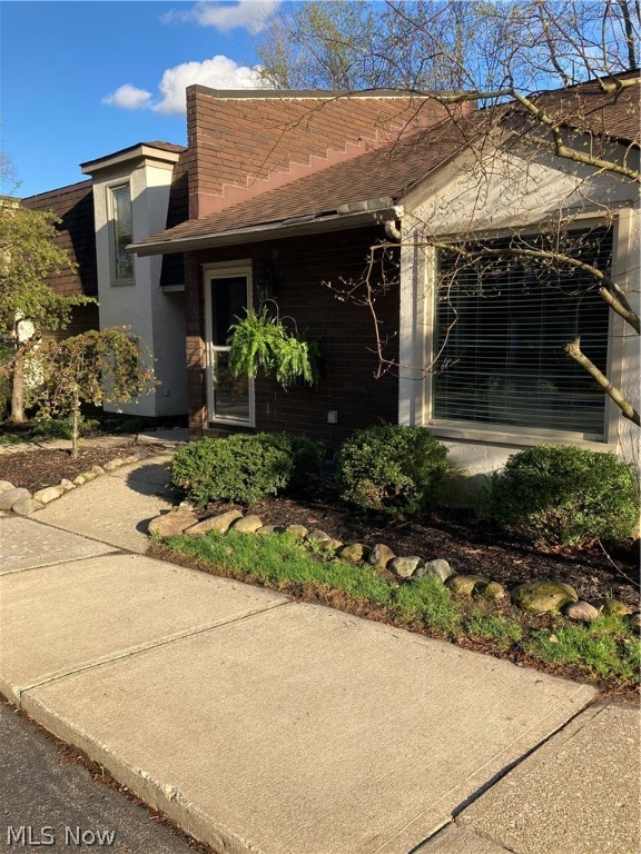 Welcome to this sharp, well maintained Townhome located on a quiet, wooded lot in Brecksville. This Split level 2 bedroom, 2 bathroom home has an office that can be used as a 3rd bedroom! All New Laminate flooring Installed throughout in 2018, Updated counter tops and backsplash in the kitchen in 2020. The Kitchen features a breakfast bar that extends into the dining room. The family room features a decorative fireplace, and sliders that open to a private, cozy patio complete with a storage shed! All levels have TONS of storage, including a large attic space located on the 2nd floor! There is a quiet Pool, and a heated Garage! HOA takes care of all landscaping, snow removal, exterior maintenance and repair. The furnace and AC are New in 2016. Screen door to patio will be repaired by Seller prior to close.