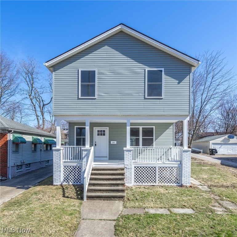 A rare opportunity to have a brand new home from the floorboards up on a great lot in the city! This 3 bedroom colonial is all brand new due to a previous fire at the location.  Great curb appeal with the inviting full size front porch to spend summer evenings outside!  Brand New furnace, A/C, electrical, plumbing, HWT, walls, flooring, appliances, windows, siding and roof!  Talk about move in ready!  The open concept first floor gives you options on how you want to lay out your furniture!  Large pantry, first floor laundry and mud room are right at your back door.  The kitchen has upscale cabinetry and gorgeous quartz countertops.  Brand new suite of stainless steel Whirlpool appliances!  Modern lighting and LVT flooring throughout the first floor.  A half bath is there also and so convenient to have on your main floor!  Brand new carpeting leads you to a unusually large 2nd floor.  There is a loft area at the top of the stairs with 3 large bedrooms and a bath.  The master is quite large with a dream closet that is 12' x 5'.  No tiny bathroom here!  Allot of space in the primary bath with a nice large linen closet right inside the space.  The basement is dry and has glass blocked windows for added security.  The backyard is large enough for a big garden and a firepit area if you choose! The large 2 car garage has new siding and a new door.  It sits back from the house with access from the alley.   Don't miss this opportunity to own a new construction home with open concept and all the brand new and modern amenities this home has to offer.  Prepare to be moved!