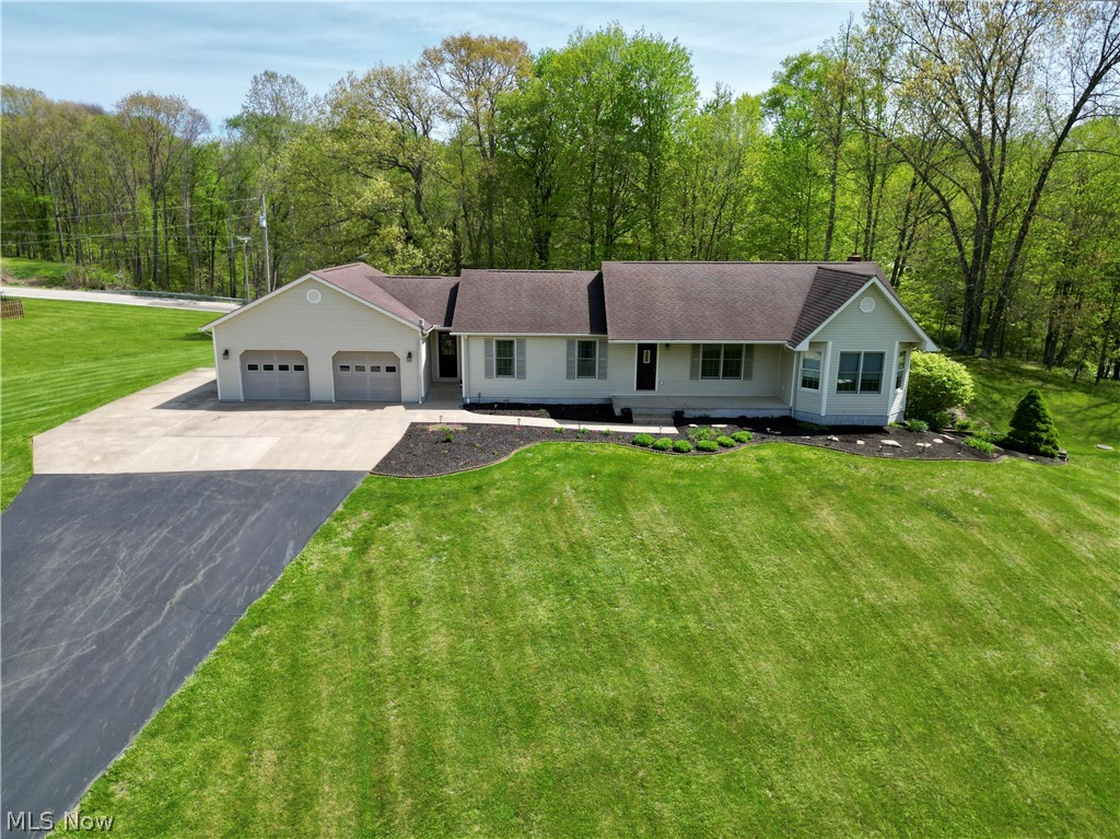 Enjoy peaceful country living in this beautifully maintained home located in the desirable Tri-Valley School District! Situated on 1.53 acres of scenic property, this 3-bedroom, 2 full bath home offers the perfect mix of space, comfort, and functionality. Step inside to find an open-concept layout with soaring ceilings, solid 6-panel doors, and beautiful wood trim throughout. The kitchen has been refreshed with new countertops and features a large new island with added storage, seating, and electric access--perfect for everyday living or entertaining. New interior paint gives the home a fresh, updated feel. The mostly finished walkout lower level offers excellent additional living space, including a bonus room ideal for a home office, playroom, or possible 4th guest bedroom. It is also plumbed for a 3rd bathroom, giving future owners even more potential! Convenient 1st floor laundry is available, along with additional laundry hookups in the lower level. Outside, enjoy the beauty of the flat backyard, complete with a charming wooden shelter house featuring a concrete floor and electric--ideal for gatherings, hobbies, or relaxing evenings! A long paved driveway leads to the concrete parking area in front of and beside the garage, offering plenty of room for extra vehicles, trailers, or even camper parking! Additional highlights include a woodburner for supplemental heat, water softener, radon mitigation system, refreshed landscaping with new mulch and flowers, and high-speed fiber optic cable internet availability. Take in gorgeous sunrise and sunset views from this well-cared-for property with solid bones and space to enjoy both inside and out!
