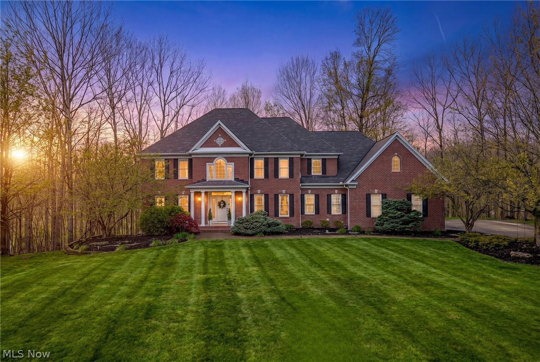 PRICE IMPROVEMENT:Nestled in the Chagrin Highlands, this remarkable brick 2-story sits at the end of a quiet cul-de-sac 5+ acres, a private oasis with meadow views & a creek winding to the rear. The 2-story entrance leads to a grand staircase that anchors the central axis, w/dining rm & living rm gracefully flanking the foyer. The great rm is the true heart of the home. Soaring cathedral ceiling & a flr-to-ceiling wall of windows commands attention, flooding the space with sunlight & greets you with serene wooded views. A handsome fireplace provides warmth & character, while an open flow from the great rm into the updated kitchen creates an inviting, light-filled core for daily living & entertaining. The kitchen features a generous center island, abundant cabinetry, & a sunlit eat-in area overlooking the back deck & tranquil yard. A private study with French doors on the main level offers a quiet workspace, & a convenient laundry//bathrm leads to the attached 3-car garage. The formal dining rm, enhanced with refined millwork, is ideal for gatherings, while the living rm provides a welcoming space for everyday living & conversation. The 2nd level hosts 4 bdrms & 3 full baths, highlighted by an spacious primary suite w/sprawling walk-in, a sitting area, a spa-like en-suite featuring dual vanities, a soaking tub & walk-in shower. 2 bdrms share a Jack-&-Jill bath,  the 4th bedrm has its own en-suite for guests. The finished lower adds generous recreation space, a 5th bedrm, full bath, work out rm & walkout with access to the yard. Outside, the backyard offers a tranquil backdrop for outdr living & gatherings w/patio, oversz deck&play area. The home is designed to maximize views & nat light, easy highway access & proximity to shopping, dining, & the Solon Rec Center. Updates include a new roof, new siding & furance 2022, tankless H2O, generator & updated kitchen that blends style w/everyday practicality. Call me directly for showings & info on this amazing property.