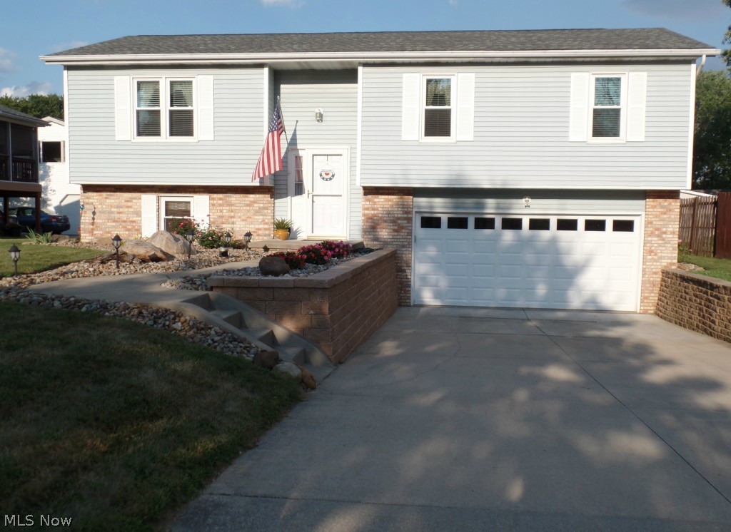 To look is to fall in love.  Updated by Ms. Clean!  Granite counters in kitchen which overlooks living room with corner fireplace.  Dining room opens to beautiful, screened rear porch leading to stamped patio and lower deck for grilling.  Updates include 30 year shingles installed in 2012, Champion Vinyl windows in 2009, remote gas fireplace with mantel in 2011, hot water tank in 2015, whole house water filtration system in 2014, central air system in 2013, large, stamped cement patio with fireplace in 2012.   If you want to walk in and do nothing, this beautiful, cozy house is for you!