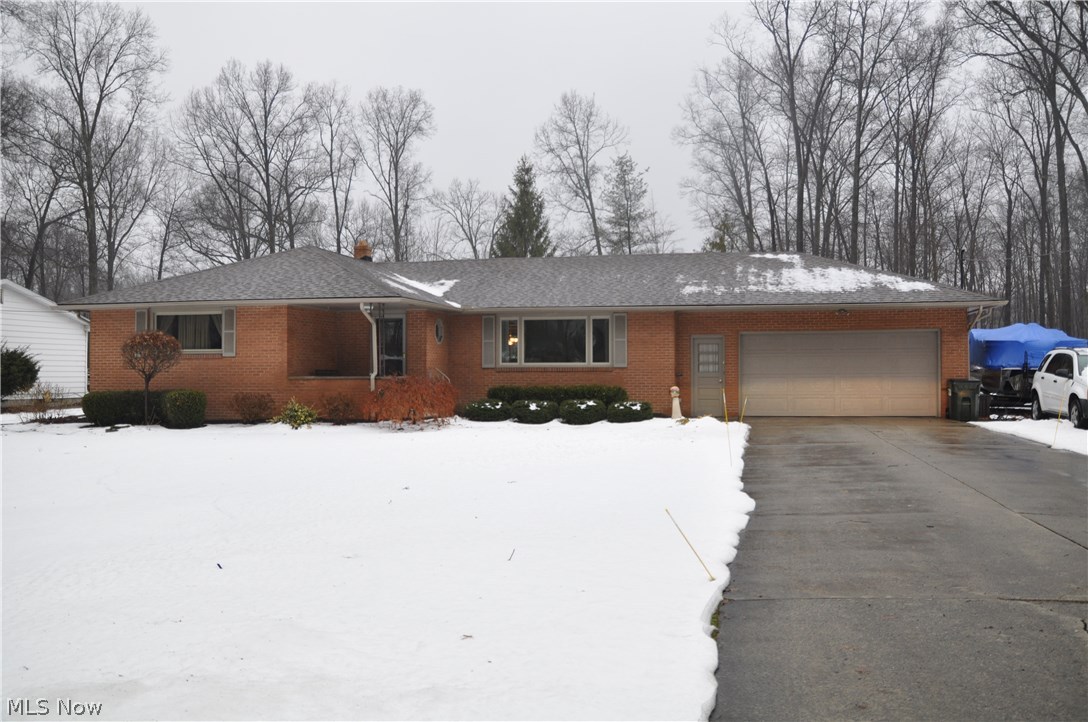 Beautifully updated 3 bedroom brick ranch w/new roof, windows, water heater, remodeled kitchen w/granite counters & ceramic tile, living room w/crown molding & gas fireplace, hardwood floors under all carpets, newer furnace, AC & electric service, tiered decking & 2 sheds. Beautiful lot in prime Howland neighborhood!