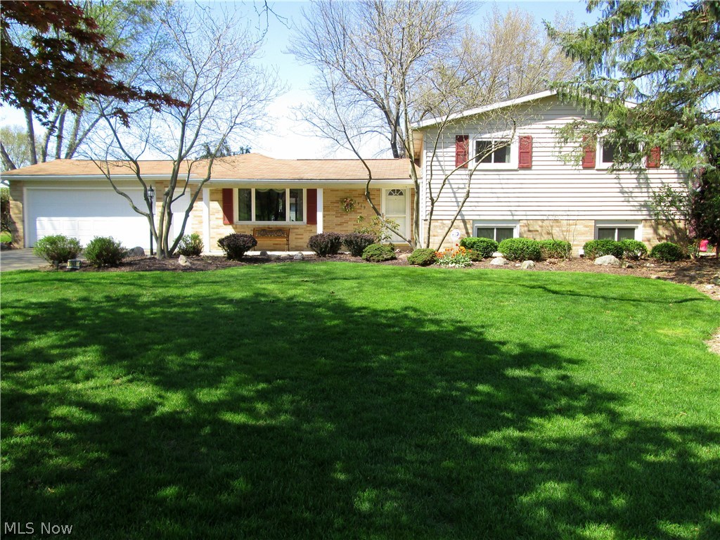 Beautiful impeccably kept lake view home. View the lake from the over-sized sunroom, living room, kitchen, family room, or master bedroom. Two fireplaces to make the home cozy in the winter. Maintenance free brick and vinyl sided exterior. Newer kitchen and appliances. Home has a living room plus a family room in the walk-out lower level.