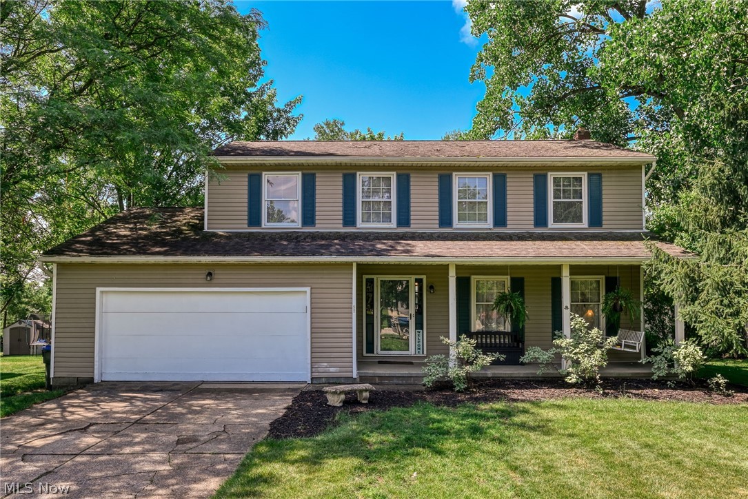 Welcome home to this spacious 4-bedroom Colonial in the desirable Wyoga Lake Estates community, within the Woodridge Local School District. The inviting front porch leads you inside, where you'll find a spacious eat-in kitchen featuring granite countertops, abundant cabinetry, a garden window, and a workspace. The kitchen flows into the family room (carpet 2026), which leads to the bright sunroom, complete with hot tub, creating the perfect place to relax year-round. Step outside onto the deck or patio and enjoy your private backyard retreat. A formal living room (carpet 2026) and dining room with a beautiful bayed window complete the main level. The second level offers a spacious owner's suite complete with a private ensuite bath, walk-in closet, and two sink spaces creating the perfect retreat at the end of the day. Three additional generously sized bedrooms and a second, recently remodeled full bath provide flexible space for guests, a home office, or hobbies.  The fully finished, recently remodeled lower level is an entertainer's dream, featuring a second kitchen with a gas range, generous recreation space, and a pool table is ideal for game nights. All kitchen appliances stay; hot tub, playset, washer, dryer, and pool table stay, offering added convenience and value for the new owner. An optional HOA provides access to the wonderful amenities of Wyoga Lake Estates, including lake access, fishing, a pavilion, and newly added pickleball courts. Conveniently located just minutes from Route 8, shopping, restaurants, walking trails, and everyday conveniences, this home offers the perfect combination of peaceful neighborhood living and easy access to everything you need. Don’t miss the opportunity to make this home your own!