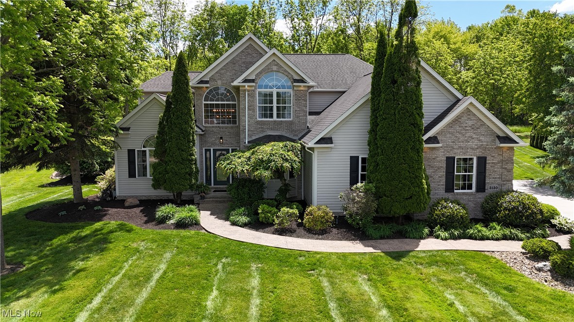 Back on market at no fault of the home! Here is your second chance to own a luxury home filled w/ style, space, and comfort in the desirable Portage Commons neighborhood! Nestled on nearly an acre, this 4-bdrm, 3-bth home is a rare find offering refined interior features, expansive living space, and an entertainer’s paradise outdoors. Step through the grand foyer and immediately feel the warmth and elegance this home exudes. The main floor features a private home office with French doors and a tray ceiling, perfect for remote work or quiet study. A formal dining room sets the stage for special gatherings, while the gourmet kitchen impresses with granite counters, stainless steel appliances, a center island,and ample cabinetry—ideal for both everyday living and entertaining. Flowing from the kitchen is a spacious living room with a cozy gas fireplace, making it the perfect place to unwind. A half bath and first-floor laundry add convenience, and fresh paint gives the entire home a bright, modern feel. Upstairs, retreat to the expansive master suite complete with a walk-in closet and a spa-like bathroom w/ double sinks, a soaking tub, and a separate standing shower. Three additional generously sized bdrms and a full bath w/ double sink complete the second level. The full basement offers incredible potential—whether you need abundant storage or want to create a custom rec room, workout space, or theater, the possibilities are endless.
Finally-Step outside to your own backyard oasis! Enjoy the summer days in the heated above-ground pool w/ a stylish wrap-around bar, outdoor kitchen space w/ natural gas hookups & and retractable awning- or sit back and relax on the large deck. A firepit and mature trees offer privacy and year-round charm. Additional highlights include- attached 3-car garage, large driveway w/ built-in basketball hoop. Newer roof, HVAC, HWT & more.Don’t miss your opportunity to own an exceptional home in one of the area’s most sought-after neighborhoods.