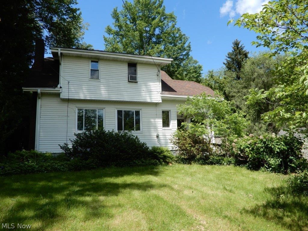Great opportunity to own this home as an investment or owner occupant!  Hard to find floor plan features first floor bedroom, full bath, and laundry, while upstairs has 2 bedrooms and another full bath.  Galley kitchen, formal dining room, mud room, and living room w/hardwood flooring. Large newer paved driveway leads to a huge attached (via walkway) 2 car garage.  Appears to have a newer roof with architectural shingles, newer furnace and air, most windows are vinyl replacement.  Basement has been waterproofed. Low-maintenance yard, two storage sheds, don't wait on this one!