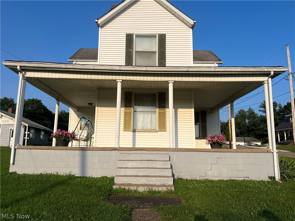 Historic charm awaits you in this 1900-built home. Lovingly maintained by the same owner for over 40 years, this property is in overall very good condition and is waiting for your personal touch. The first floor has a newer bath with a walk in shower. The furnace, air and hot water tank were all replaced in 2024. Imagine enjoying summer evenings on your relaxing front porch that wraps around the side of the house. This property consists of 2 lots that total about a 1/3 of an acre. The garage is 30 x 22 per the auditor records. This home is being sold 'as is'.