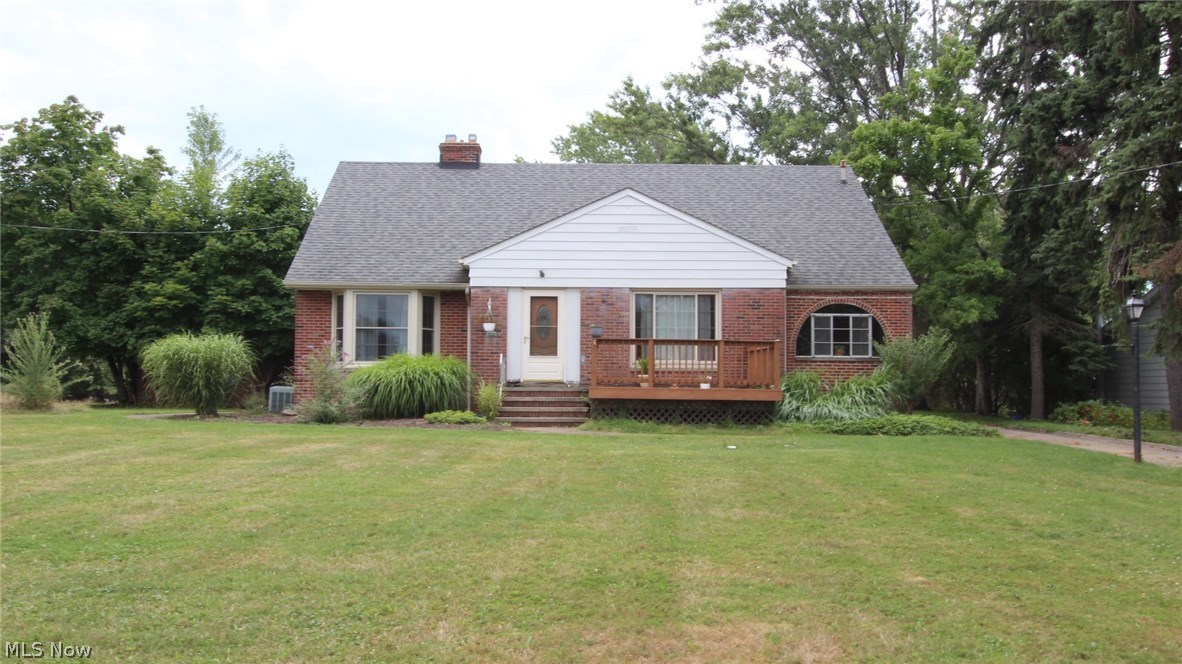 Charming Cape Cod Sitting on 1.5 Acres of land W/ Luscious Fruit Trees! 3 bedroom, 2 bath with additional living space off of the master bedroom. 3 car garage, Full partially finished basement that features a full Wet Bar & Fireplace with an antique functional jukebox. Commercial Central Air Conditioning that quickly cools the house on a hot summer day. Hardwood floors throughout. Home features spacious dining room with cozy gas/log fireplace. The home is nicely landscaped with a freshly re-done front deck, 365 day sun-room with supplemental heating. Kitchen W/ Island Bar, built in cedar cabinets, new furnace 2015, hot water tank 2009, Concrete driveway to the curb 2009, 30 year Roof/ Gutters/ Garage Doors/ Exterior Doors/ Front & Side Windows 2007. Waterproofed front. Home has plenty of storage and additional living space, master bedroom features a dressing room multiple walk in closets. Must see!