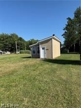 This is approximately a 432 Sq. Ft. Tiny home.  Just use your imagination.  The inside is an open room and has a small dinette kitchen plus a half bath.  The awesome thing about this little place is the beautiful view overlooking Lake Erie plus you're close to Geneva on the Lake for entertaining and fun.  This little place could be used as a great camp out with family and friends.  What a great place to hang out and take your jet ski or boat out.  You will enjoy spectacular sunsets with a wide open view,  The state re-did the lake bank and when completed, they installed stairs down to the bottom but no guarantees that it's still in there.