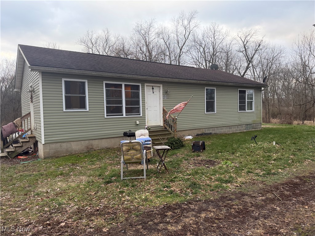 Tucked away on 2.48 secluded acres, this North Lawrence property offers privacy, nature, and opportunity in a peaceful setting. Completely rebuilt in 2017 from the foundation up, this ranch-style home provides a solid structure and a blank canvas for your vision. A creek runs through the property, while the home also sits near Lawrence Township Park, allowing you to enjoy both natural surroundings and nearby recreational space—without the two being connected. Mature trees surround the property, creating a private, wooded feel, especially in the summer months. Inside, the home features an open eat-in kitchen and living room, ideal for entertaining or everyday living. The layout includes three spacious bedrooms, a full hall bathroom, and a private owner’s suite with its own bathroom and a large walk-in closet. The home is all electric and equipped with central air. While the home does need some TLC, the potential is undeniable, both inside and out. With acreage, privacy, and a desirable ranch layout, this property is perfect for buyers looking to create their own retreat. Conveniently located near Route 21, offering easy highway access while still feeling tucked away from it all. Don’t miss this rare opportunity to own acreage in North Lawrence with space, privacy, and room to make it your own.