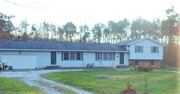 This home located on a cul-de-sac offers plenty of privacy.  Nestled back on over 5 acres with a beautiful back yard view of wooded lot.  Split level plan plan offers two living spaces with shared finished lower level.  Four bedrooms, four bathrooms, two kitchens, two livingrooms. additional family room.  Master suite with private bath and  balcony overlooking back yard.  Finished lower level with bar, two sets of French doors and shared recreation rooms great for entertainment!  Sauna with changing area.  Large laundry room.  Two car garage.