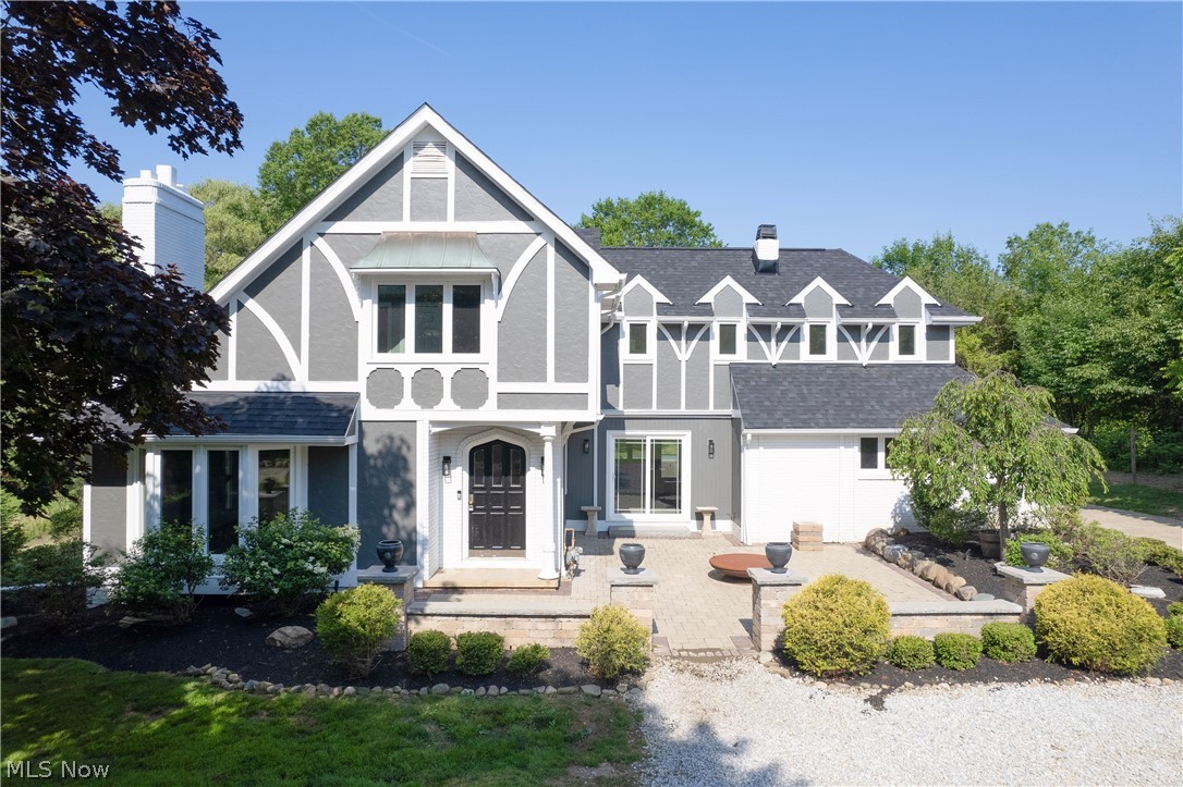 Nestled on a private 1.3 acre lot in the desirable Sagamore Hills and Nordonia
School District, this stunning 4 bedroom, 3 bath tudor-style colonial combines
timeless character with exceptional updates. A fresh gravel driveway leads to the
home, where a beautiful paver front patio with illuminated columns creates an
inviting first impression. The picturesque property also features a stocked pond,
offering a peaceful setting to enjoy year round. Inside, the gorgeous updated kitchen
is sure to impress with custom cabinetry accented by crown molding, granite
countertops, a tiled backsplash, tiled floors, and brand new appliances (2026).
Spacious living areas provide plenty of room to entertain, highlighted by two
fireplaces-one in the living room and another in the family/bonus room. Other
recent updates offer a peace of mind, including a new roof (2025), fresh exterior
paint (2025), new windows (2021), remodeled master bath (2019), new a/c (2022),
and hot water tank (2021). This is a rare opportunity to own a beautifully
maintained Tudor style home on a private scenic lot in one of Sagamore Hill’s most
desirable locations. Call today to schedule your showing!