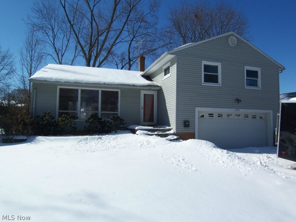 Space it the key to this 3, possible 4, bedroom and 2.5 bath 4 level split.  The large living room opens to the Kitchen and Dining Area that opens to the rear deck.  A fireplace highlights the family room that walks out to the back yard.   A bonus/rec/4th bedroom is on the lowest level.  The bathroom is updated in the master suite.  Wood floors run throughout the second floor of nice sized bedrooms.  The rear yard is completely fenced.  This home has an attached 2 car garage, office, laundry area, and so much more.    A community/private pool can be joined for a minimal cost.  Ask agent for details.