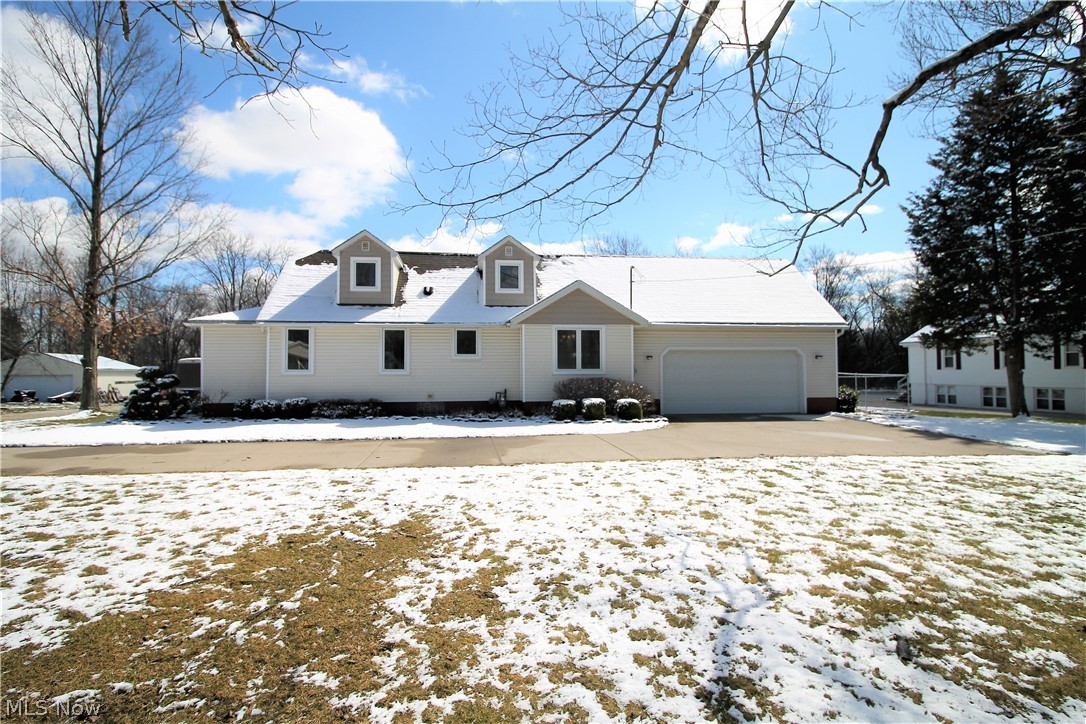 Welcome to this bright and gorgeous Cape Cod which has a first floor master suite, huge walk in closet and full bathroom. The first floor also offers a great room with spiral staircase to the upstairs, large sun room with lots of windows with built in blinds and offers so much sunshine, updated kitchen with Hickory cabinets and Corrian counters, gas range and eat in dining area.  The great room and the two upstairs bedrooms are wired for speakers. To finish up the first floor there is a laundry room with cabinets and long counter and a full bathroom. The upstairs offers two bedrooms and a half bathroom, the one bedrooms has custom oak trim with built-ins. There is a huge fenced in backyard with double gate fence 2018. The two car attached garage is heated and there is a detached three plus car garage with workshop and upstairs storage. There is a large driveway and extra side pad for parking. The home offers so many updates which include modern fixtures and the home was just recently p