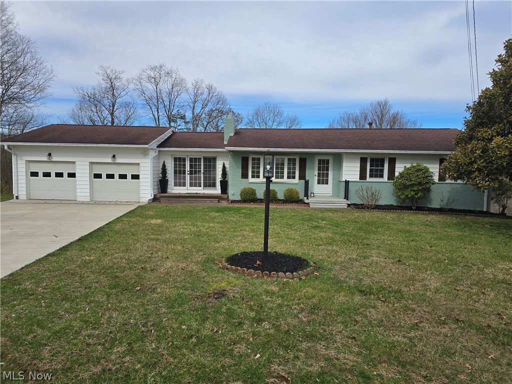Beautifully updated 3BR/2BA ranch on.8939 acre priced to sell.  This move-in ready home offers fresh interior paint, new carpet, updated lighting and a warm, inviting layout. Kitchen freshly painted with new Corian countertops, new refrigerator & new stovetop. Cozy living room with fireplace plus family room featuring new gas log fireplace. Updated bath includes new vanity, lighting & ceramic tile shower surround. Finished basement bonus room with fireplace, abundant built-ins & canning kitchen adds flexible living space. New concrete driveway, new front porch & gutters w/ guards. 2-car garage plus 16x24 pole garage w/ electric & dual access doors. 200-amp service. Large deck overlooking spacious 1.26-acre lot. Convenient to shopping, banking & highway access. A rare combination of updates, space & functionality!