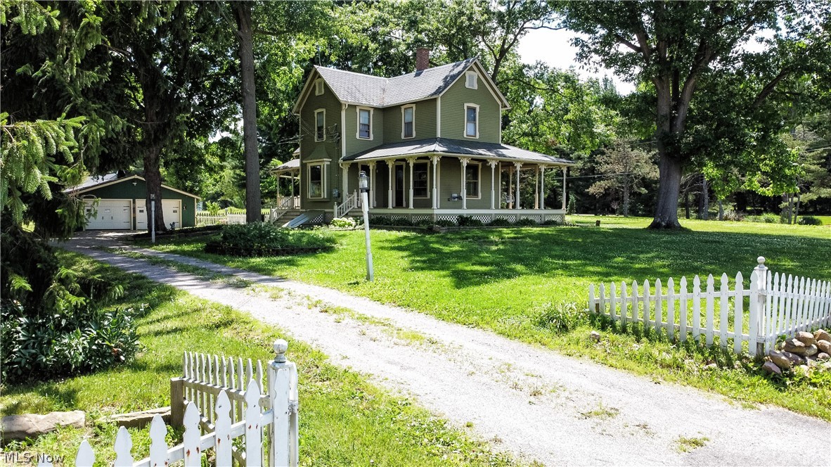 Known as Easton Farm, this charming 1888 Victorian home is believed to be one of the oldest farmhouses in Westfield Township. Nestled on 4 beautiful acres, this historic property offers a rare opportunity to own a piece of Westfield history. An inviting wrap-around porch sets the stage for the character and craftsmanship found throughout the home. Inside, you’ll find beautiful hardwood floors, original woodwork and Victorian details, and timeless charm throughout. The spacious first floor offers multiple gathering areas including a formal dining room, wainscoting, built-in cabinet, and storage closet off the side porch. The cozy family room features a charming window seat. Double doors lead to an elegant living room with built-in bookshelves, detailed trim, wainscoting, and access to the wrap-around porch. The kitchen features a double bowl sink, electric range and microwave, and access to the back deck. A 1st flr bedroom offers flexibility as an office, or a bedroom and includes a half bath. Upstairs are 3 bedrooms and a full bath, hardwood floors, ample closets, ceiling fan/lights, and charming Victorian details. The full bath offers a newer large shower and large storage closet. The property boasts an 40x70 bank barn with electric (2024), multiple work/storage areas with 220v circuits, an upper level perfect for entertaining, vehicle storage, hobbies, etc. A 26x40 multiple horse barn includes electric, water, and access to a fenced pasture. The extra large 2-car garage adds even more functionality. Enjoy the outdoor deck, Pergola 2024, fenced-in area for pets or children, and peaceful acreage. Additional updates: insulation, Roof 15 years, public water available at street, Kinetico water softener system plus Reverse Osmosis added 2023, furnace 2023, Oven/Range and microwave 2025, newer Septic System 2024, Upgraded house electric panel 2023, Don’t miss this opportunity to own a historic Victorian farmhouse with incredible character, land, and outbuildings!