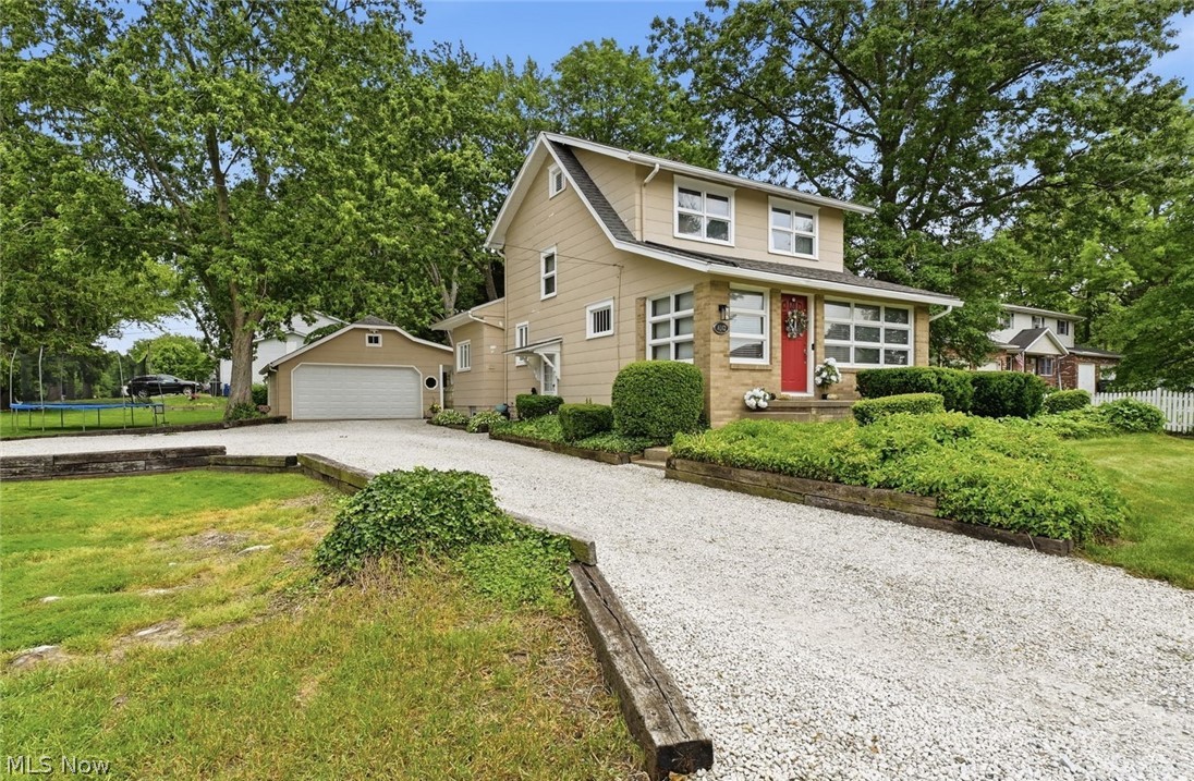 Timeless charm and modern comfort with this exceptionally maintained 3 bedroom, 1.5 bath classic home!  The stunning fully remodeled kitchen(2024) features quartz countertops, all new cabinetry and stylish fixtures, while both the full and half baths have been thoughtfully updated with today's finishes. Spacious living and dining areas provide plenty of room for everyday living complemented by a bright and inviting sun room.  Outside, this property shines!  You'll find a beautifully landscaped , partially fenced corner lot, an oversized 2 car garage, and an additional parking pad for added convenience.  Relax or entertain in the wonderful back yard featuring a covered patio, and additional newly poured patio space. Don't miss the newly remodeled studio space with air conditioning perfect for photography, art, hobbies or any creative ideas!  This move in ready home offers the perfect blend of century character, updates, and versatile living space both inside and out. 1 year home warranty included for added peace of mind!  Don't miss this one!