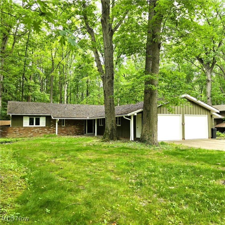 Be first or be sorry! Longtime owner took pride here! Three bedroom, two and a half bathroom Ranch on a cul de sac abutting the Metroparks! Easy to show! Immediate possession! Updated eat-in kitchen with granite countertops, stainless steel appliances, stone backsplash, track lighting and a breakfast bar! First floor laundry room with extra cabinets and washer & dryer staying. Living room has built-in bookcase and a slider leading to the two tier deck, formal dining room also has a slider leading to the two tier deck. Family room has brick fireplace and three big windows overlooking the beautiful heavily wooded Metroparks! Main bathroom updated with custom tile tub surround and granite countertops, custom tile shower & ceramic tile floor. Basement has recreation room, mechanical room, loads of storage & glass block windows with vents. Backyard has 25x14 "party" room with a covered patio and a patio overlooking the Metroparks. Oversized heated two car garage with hot & cold water. Includes one year home warranty!