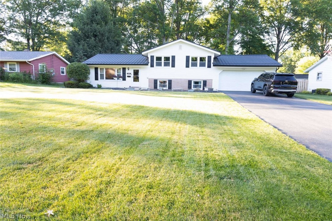 Move-In Ready 3 Bedroom / 1.5 Bath Bi-Level in a Quiet, Amazing Neighborhood in the Austintown School District. This well-maintained, warm and welcoming home sits on a large lot with excellent curb appeal. The main level features a large living room, dining room, and spacious kitchen. The lower level offers a huge family room, laundry room, and half bath. Upstairs you’ll find a master bedroom with hardwood floors and ample closet space, plus two additional nice-sized bedrooms. The full bath is conveniently located between all bedrooms and connects to the master. Recent Updates & Highlights: • Brand new metal roof (2025) • Recently updated flooring throughout • A/C & furnace replaced 2015 • HWT 2014 • Siding & windows updated 2004 Enjoy the nice fenced-in backyard — perfect for pets and outdoor living. A double-wide, extra-long driveway leads to the attached 2-car garage with plenty of parking and storage. This is a great buy in a wonderful neighborhood. 330 565 328.3