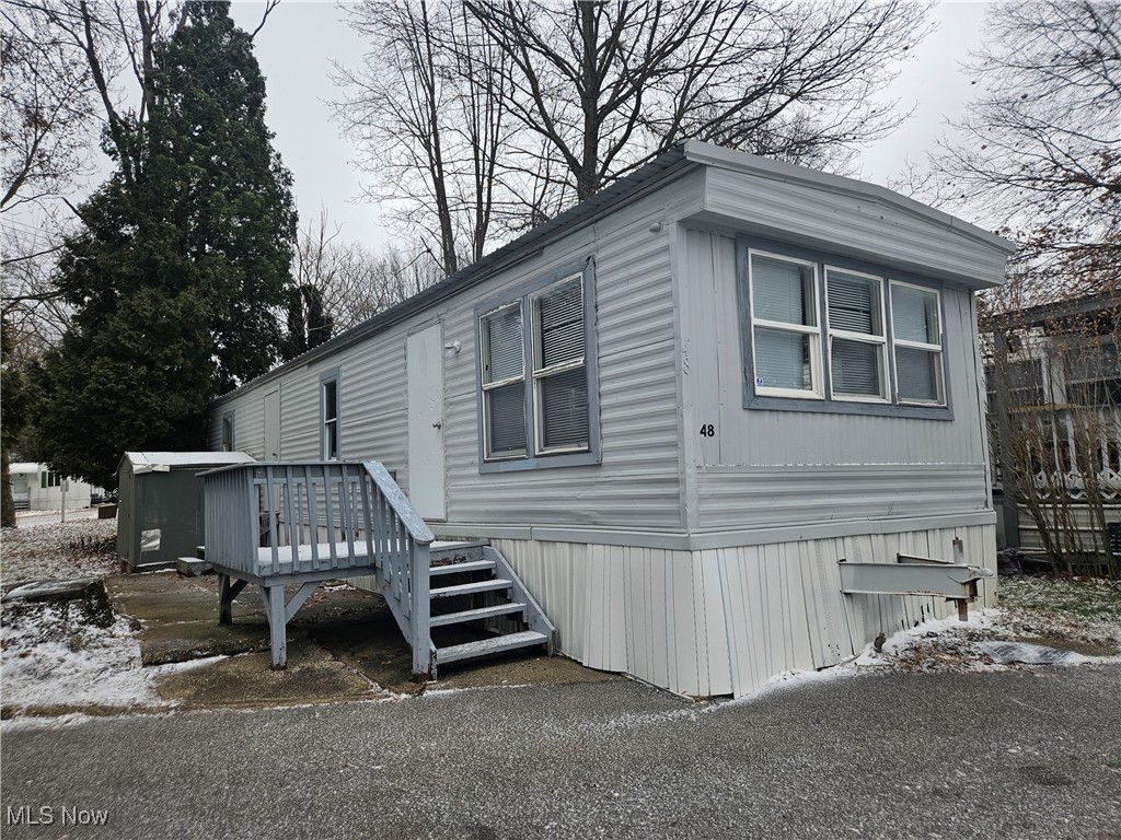 Lot #48 - Newly remodeled and ready to move into!  This cozy 1 bedroom mobile offers a nice open living room to kitchen space, 1 full bathroom with laundry hook up and 1 bedroom.  This is a great opportunity to own your own home!  The location is nice, situated across from Springfield Lake!  Minutes to shopping, eateries, expressway and more!  Call today to schedule a time to see!  All mobiles in this park must be owner occupied. Units cannot be moved.  Lot rent is $375.  Mobile owner pays all utilities.
