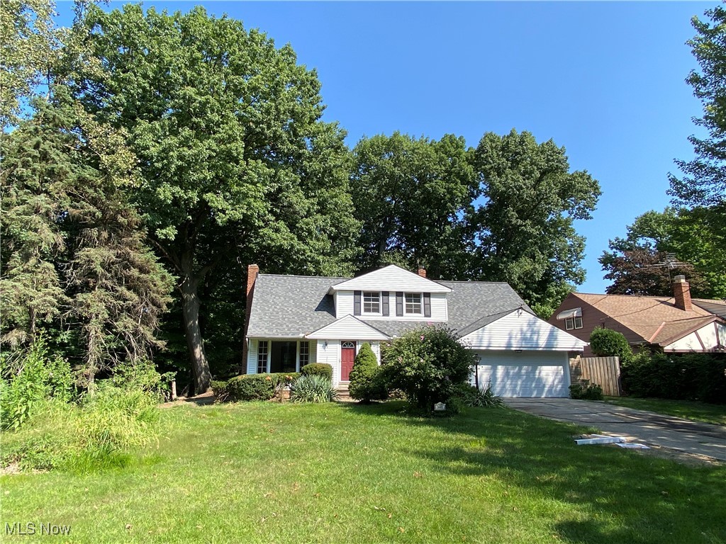 Are you ready to invest some sweat equity into bringing this beauty back to her full glory?  Here is your chance to own a home with your very own nature preserve as your back yard.  This lovely home, on an equally lovely level wooded and parklike ravined lot has  So. Much. Potential.  Plenty of backyard space for enjoying the outdoors before the ravine.  This quaint neighborhood is surrounded by the Ninemile Creek ravine valley giving it a charming private feel.  The entry foyer with coat closet greets you as you enter this home to a charming center hall cape cod layout. To the left, a lovely wood mantled fireplace centers the room with original green marble surround and is flanked by beautiful original wood mutton picture windows and hardwood floors which open to the rear three season porch.  To the right the bright and cheerful dining room connects to a spacious eat kitchen with room for a breakfast area and windows to the backyard.  The kitchen was updated in the 1990's with solid wood cabinets, laminate counters and flooring all in remarkably great condition except for one missing cabinet door. A 1/2 bath and large mudroom/laundry room accesses garage or rear yard, completes this level.  Up the center staircase you'll be impressed by all three bedrooms sizes and wonderful closets tucked into every nook and cranny. Don't miss the walk in cedar lined closet and double linens to each side in the hallway. The full bath, updated in 2022 is shared by all bedrooms.  A second stone and brick fireplace in the basement awaits your finishing touches to restore the room to a finished state. Roof estimated 2010, Refrigerator-2015-ish, stove 2010-ish, furnace 2009-ish, dishwasher-2022, light fixtures throughout main floor-2020. Garage door new in 2024. Seller can make no repairs, priced accordingly. Home being sold " AS IS". Buyer must assume city Point of Sale violations. She needs some TLC but offers an opportunity for a wonderful home on your own personal woodland setting.