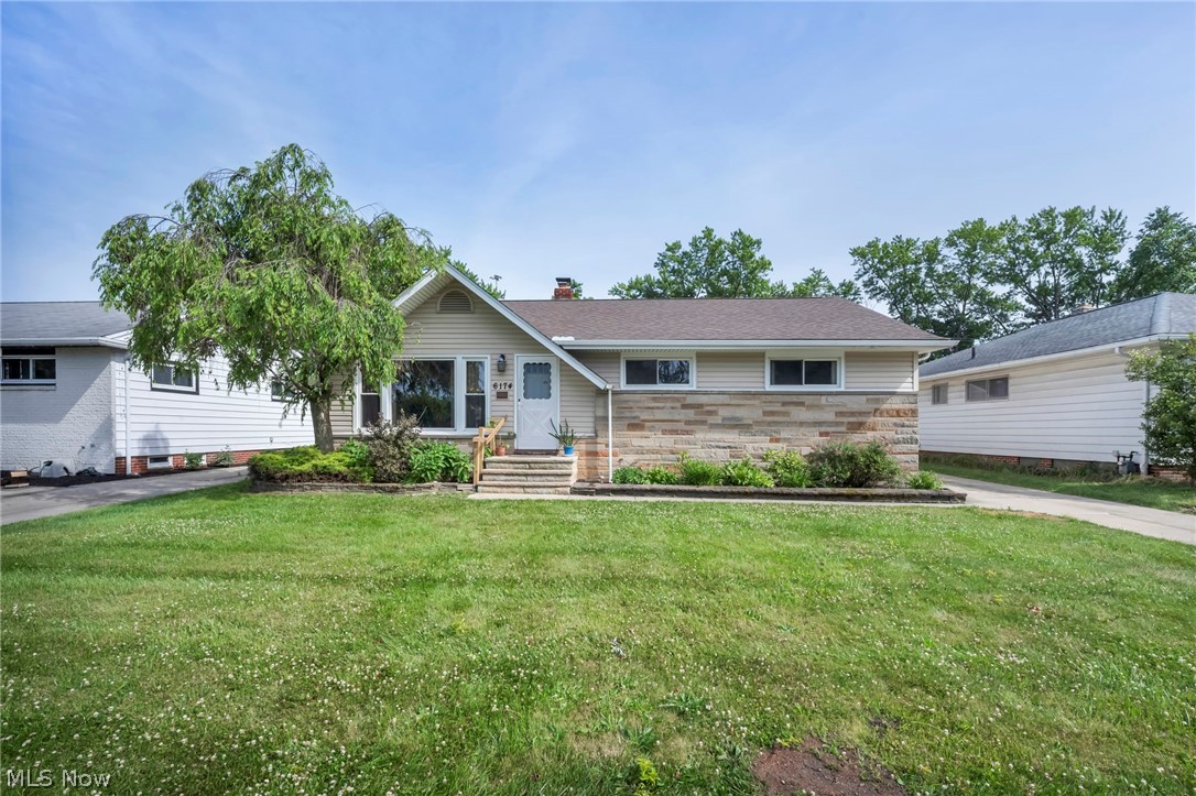 Welcome Home to this Charming Ranch offering functional one floor living situated at 6174 Westerham Road centrally located in Mayfield heights within the celebrated Mayfield School District!! Upon entering you’re welcomed to a small foyer leading to a bright front living room with its large bay window with a view of the landscaped front yard. Lots of natural light throughout this home. As you transition thru to the dine-in Kitchen there is a sliding glass door that enhances this area with space with light and access to the backyard. Beyond the dine-in area you will find convenient kitchen cabinets and Laminate counter space, a stainless steel sink with a view of the backyard. All newer 2022 Stainless steel kitchen appliances. The first floor is completed by three bedrooms and one full and one half bath. The Master bedroom features an attached half bath. The partially finished basement provides additional living space including a recreation room, a laundry area and Utility room. Outside consists of a large backyard and a 2.5 car Detached Garage, a concrete patio for outdoor entertaining, potential gardening area behind the garage fully fenced in yard. Newly installed roof 2025. Close to shopping, many restaurants, walking distance to parks and pool!! All the amenities Mayfield Heights has to offer, this home combines comfortable convenience, functionality, and a great location!! Point of Sale compliant. This property is being sold in as-is condition; the seller will make no repairs.