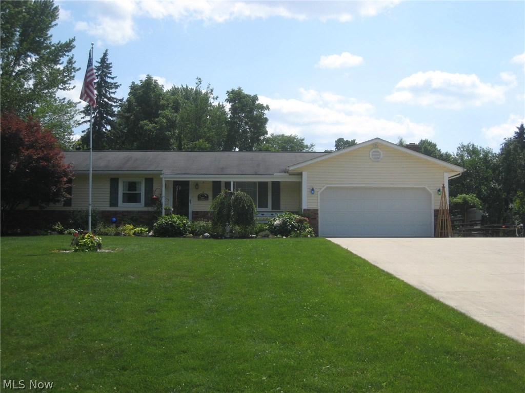 Looking for a ranch!  This custom Amish built home has been meticulously maintained and thoughtfully updated.  As you pull in on the newer concrete drive and approach the house, you'll experience a warm and inviting feeling.  The front porch welcomes you and as you step in, you'll love the beautiful hardwood flooring.  Light, bright and open as you walk through.  The kitchen with custom Hickory cabinets and lots of counter space has a wall of cabinets, newer appliances and laminate flooring.  It opens to the dining area with a large bay window overlooking the beautifully landscaped yard with privacy fence and the family room with a full wall Brick fireplace w/gas logs and hand hewn mantle. The sliding door opens to the covered deck.  The yard features a shed with a brick patio, a pergola with a swing and a fire pit.  Great for entertaining. The master bedroom features a triple closet and a remodeled half bath. Bedroom 2 is equally as large and the 3rd is being used as an office.  The l