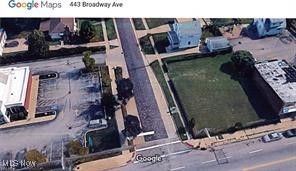 Commercial Corner Lot, 80 Ft Frontage on Broadway Ave x 97 ft on East Grace. .18 acre. Taxes: $1351.72 per year All Utilities at Street. Zoned B-2A, List of Approved Uses and Board Approved Uses on file in MLS Supplements or Call Office. (CAN NOT BE USED AS A STAND ALONE USED CAR LOT)