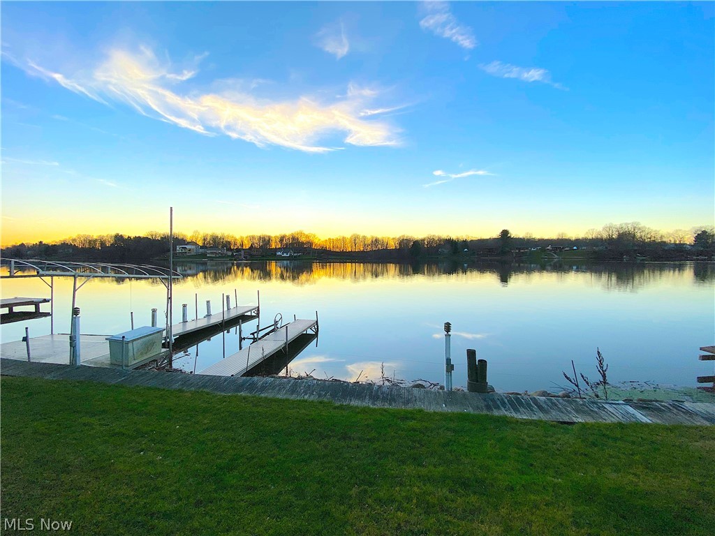This is an exceptional Waterfront, westward facing Buildable Lot.  The views over the lake provide gorgeous Sunsets.  Activities of Water and Wakeboard skiers are a great joy to view from a deck as part of a new home you could have built to your specifications.  A partially cleared and improved lot with a gentle slope down to the Waters edge, with a Seawall and dock in place. Available City Water and Sewer along with other Utilities of Natural Gas and Electric are immediately available at the road for tap-in. What a great location and setting, this is an exceptional property for the right Buyer looking for one of the best, last
remaining waterfront lots.