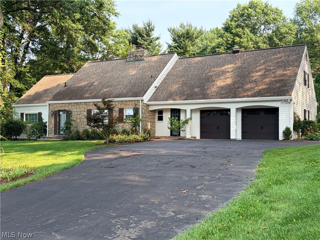 Charming Cape Cod home with 4-5 Bedrooms, located directly across from the Wooster Country Club! This inviting home offers two convenient entrances—one through the foyer and the other into a practical mud/utility room complete with a half bath. The main level features an owner's suite with a walk-in closet and private shower bath, along with a versatile room that can serve as a home office or 5th bedroom. The kitchen offers maple cabinetry, a breakfast bar, a wall of pantry/storage space, and appliances. Just off the kitchen is a formal dining room with wood flooring. The spacious living room features a bay window overlooking the storybook fenced backyard, a stone fireplace (currently gas, with the option to convert back to wood-burning), and a built-in bar, creating the perfect space for relaxing or entertaining. Upstairs, you'll find 3 bedrooms that share a full bath. The one bedroom, featuring its own walk-in closet, provides access to the adjoining bedroom. An impressive dedicated storage room offers exceptional space for seasonal décor, organization, or hobbies. The finished lower level adds valuable living space with a spacious recreation room, perfect for movie nights, a playroom, or a game room. Step outside to enjoy the expansive screened porch—an ideal spot for outdoor dining, relaxing with a book, or entertaining guests. The large patio extends your outdoor living space, while the fully fenced backyard is perfect for pets, children, or gardening. A storage shed provides additional space for lawn and garden equipment. Combining character, functionality, and an outstanding location, this charming home is a wonderful opportunity in the heart of Wooster.