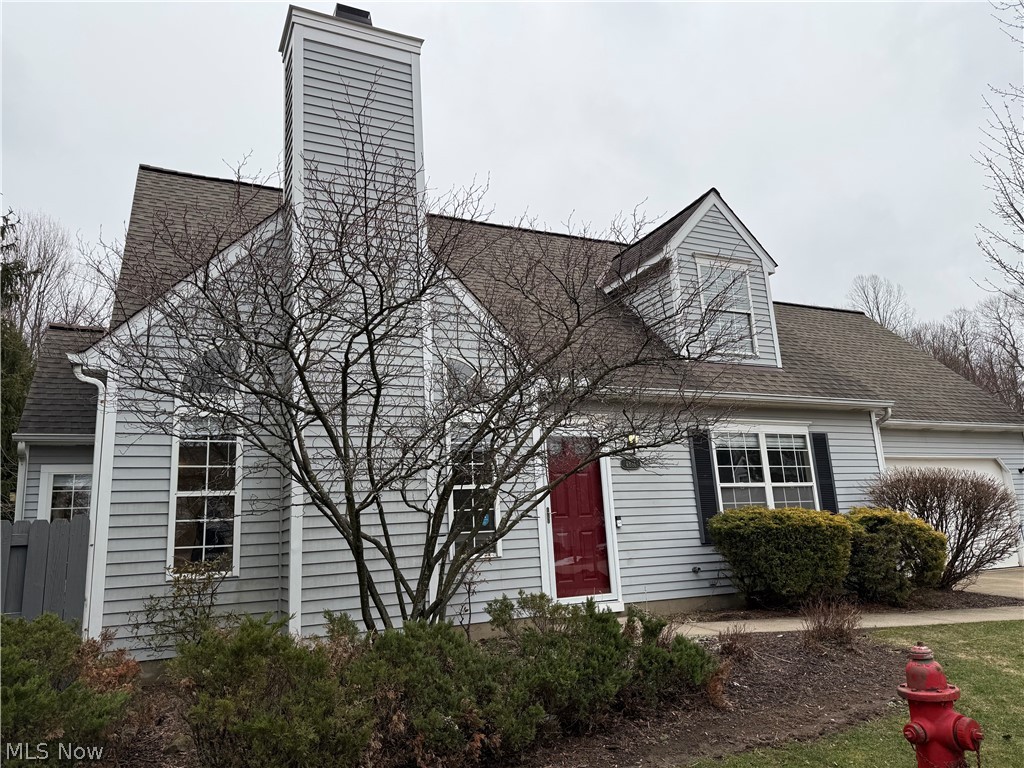 Welcome to easy living in this charming Cape Cod–style condo in the desirable Hillary Place Community! With 1,645 square feet of thoughtfully designed space, this 2-bedroom, 2 Full bath home offers the perfect blend of comfort and convenience. There's also a large Bonus room with closets on the upper floor that can be used as a Third bedroom.
The inviting Great Room features a cozy fireplace — ideal for relaxing evenings or gathering with friends. The two-story open layout features beautiful windows that provide lots of natural light and an open, spacious feeling.The Dining area features sliding doors providing access to the patio, which has a fence and Natural Landscaping that offer privacy. The throughly renovated Kitchen includes all stainless appliances. Just off the Kitchen is the Laundry area with utilty sink ( Washer and Dryer Stay ).Upstairs has a huge open Loft area, a second Full updated Bath, the second large bedroom and a Huge Bonus room with closets. Updates include new Hardwood flooring throughout the first floor - 2021, renovated Kitchen - 2019, fully renovated bathrooms - new cabinets and utility sink in the Laundry area - 2026. New front Door - 2026 and new luxery vinyl flooring and new carpeting throughout. The entire home has been recently painted. All new Window Blinds. There's abundant storage available, even built in shelving in the garage.
You will love this Home, it is truly Move in Ready!